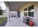 Covered patio area featuring a Blackstone grill, ideal for outdoor cooking and entertaining at 2354 Emerald Springs Dr, Apopka, FL 32712