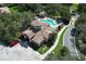 Community clubhouse and pool featuring lush landscaping, parking, and pedestrian walkways at 25974 High Hampton Cir, Sorrento, FL 32776