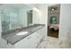 Bathroom vanity with granite countertops, double sinks, and modern lighting fixtures at 25974 High Hampton Cir, Sorrento, FL 32776