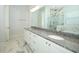 Bathroom features a granite vanity with double sinks and stylish fixtures at 25974 High Hampton Cir, Sorrento, FL 32776