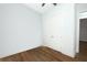 Bedroom featuring hardwood floors, double doors, and neutral walls at 25974 High Hampton Cir, Sorrento, FL 32776