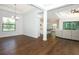 Spacious dining room featuring hardwood floors with view into living room and kitchen at 25974 High Hampton Cir, Sorrento, FL 32776