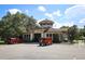 Exterior view of the fitness center boasting charming architecture with ample parking space at 25974 High Hampton Cir, Sorrento, FL 32776