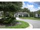 Charming single-story home with manicured landscaping and a welcoming front entrance at 25974 High Hampton Cir, Sorrento, FL 32776