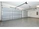 Spacious garage featuring epoxy flooring, two garage doors, and ample room for parking at 25974 High Hampton Cir, Sorrento, FL 32776