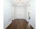 Entry hallway featuring hardwood floors and double doors at 25974 High Hampton Cir, Sorrento, FL 32776