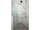 Modern shower featuring sleek fixtures, frameless glass doors, and luxurious tile work at 25974 High Hampton Cir, Sorrento, FL 32776