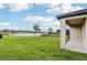A spacious backyard with a lake view at 3093 Neverland Dr, New Smyrna Beach, FL 32168