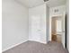 Neutral bedroom featuring carpet floors, white walls, and white doors at 3093 Neverland Dr, New Smyrna Beach, FL 32168