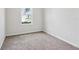 Neutral bedroom featuring carpet floors, white walls, and natural light at 3093 Neverland Dr, New Smyrna Beach, FL 32168