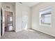 Bright bedroom with neutral walls, carpet and an open doorway to view of the rest of the house at 3093 Neverland Dr, New Smyrna Beach, FL 32168