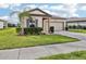 Charming single-story home featuring a well-manicured lawn and attached two-car garage at 3093 Neverland Dr, New Smyrna Beach, FL 32168