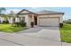 Charming single-story home featuring a well-manicured lawn and attached two-car garage at 3093 Neverland Dr, New Smyrna Beach, FL 32168