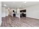 Open-concept kitchen and living area with stainless steel appliances and dark wood cabinets at 3093 Neverland Dr, New Smyrna Beach, FL 32168