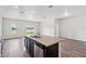 Open concept kitchen with granite countertops, stainless steel appliances and a modern island at 3093 Neverland Dr, New Smyrna Beach, FL 32168
