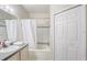 Bright bathroom showcasing a tub with a shower and a vanity with a sink at 3428 Soho # 301, Orlando, FL 32811
