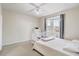 Cozy bedroom with ample natural light from the bay window and a ceiling fan at 3428 Soho # 301, Orlando, FL 32811