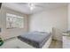 Bright bedroom featuring a comfortable bed and a view of the outdoors at 3428 Soho # 301, Orlando, FL 32811