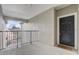 Inviting entryway with a black door and secure entry to the building at 3428 Soho # 301, Orlando, FL 32811