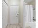 A tiled entry way to the property featuring a bathroom at 3428 Soho # 301, Orlando, FL 32811