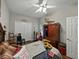 Cozy bedroom featuring a ceiling fan, closet doors, and a window for natural light at 3556 Sunset Isles Blvd., Kissimmee, FL 34746