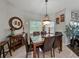 Elegant dining room with a marble-top table, chandelier, and stylish décor at 3556 Sunset Isles Blvd., Kissimmee, FL 34746