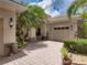 Charming home with a brick driveway, mature trees, and well-maintained landscaping at 3556 Sunset Isles Blvd., Kissimmee, FL 34746
