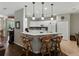 Bright kitchen with white cabinets, granite counters, and stainless steel appliances at 3556 Sunset Isles Blvd., Kissimmee, FL 34746