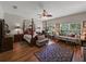 Expansive main bedroom with hardwood floors, decorative rug, and natural light from multiple windows at 3556 Sunset Isles Blvd., Kissimmee, FL 34746