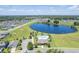 A high up view of neighborhood amenities like swimming pool, playground, and picturesque lake at 3759 Crimson Clover Dr, Mount Dora, FL 32757