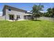 Expansive backyard with a covered gazebo, patio area, lush green lawn, and privacy fence at 3759 Crimson Clover Dr, Mount Dora, FL 32757
