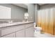 Well-lit bathroom featuring a double sink vanity with granite countertops, neutral walls, and a shower-tub combo at 3759 Crimson Clover Dr, Mount Dora, FL 32757