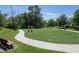 Community fitness area in a green setting with benches and walking paths for an active lifestyle at 3759 Crimson Clover Dr, Mount Dora, FL 32757