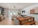 Open living space with natural light, dining area and outside access at 389 Meadowland Pt, Oviedo, FL 32765