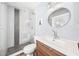 Modern bathroom featuring a walk-in shower, stylish vanity, and sleek fixtures at 402 Saint Dunstan Way, Winter Park, FL 32792