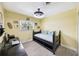 Bright bedroom with a dark furniture, neutral colors and lots of natural light at 402 Saint Dunstan Way, Winter Park, FL 32792