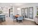 Cozy dining area with seating for four, stylish decor, and lots of natural light at 402 Saint Dunstan Way, Winter Park, FL 32792