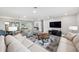 Bright living room with a spacious layout, contemporary furniture, and neutral tones perfect for relaxation at 402 Saint Dunstan Way, Winter Park, FL 32792
