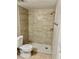 Updated bathroom showcasing a modern tiled shower with a white tiled base and rainfall shower head at 4606 Commander Dr # 1126, Orlando, FL 32822