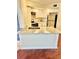 Bright kitchen featuring granite countertops and modern stainless steel refrigerator at 4606 Commander Dr # 1126, Orlando, FL 32822