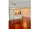 Open floor plan with kitchen and living room, featuring wood floors and ample space at 4606 Commander Dr # 1126, Orlando, FL 32822