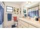 Bathroom featuring a vanity with sink, a toilet, and a shower/tub combination at 468 E Oakwood Ave, Orange City, FL 32763