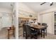 Cozy dining area with a view into the kitchen, featuring a dark wood table and chairs at 468 E Oakwood Ave, Orange City, FL 32763