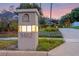 Well-lit address marker displaying '5102', set amidst lush greenery and landscape at dusk at 5102 Round Tree Ct, Orlando, FL 32819