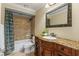 Well-appointed bathroom with tub, shower, and custom vanity at 5102 Round Tree Ct, Orlando, FL 32819