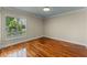 Bright bedroom with hardwood floors, plantation shutters and natural light at 5102 Round Tree Ct, Orlando, FL 32819