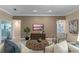 Spacious living room features neutral tones, comfortable seating, and modern decor at 5102 Round Tree Ct, Orlando, FL 32819