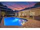 A luxurious pool and outdoor living space are perfect for entertaining at 5102 Round Tree Ct, Orlando, FL 32819