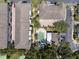 An aerial view of a condo community featuring a swimming pool and lush landscaping at 528 Lanark Ct, Orlando, FL 32806