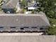 An aerial view of townhomes boasting attached garages and street-facing entrances at 528 Lanark Ct, Orlando, FL 32806